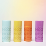 Load image into Gallery viewer, four bottles of face stick sunscreen lined up next to each other, from left to right the colors are blue, yellow, orange, purple
