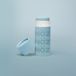 Load image into Gallery viewer, close up of the blue Noz face sunscreen stick with the cap off of it, all in front of a blue background
